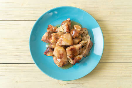 grilled bananas with coconut caramel sauce on plateの写真素材