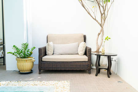 comfortable pillow decorate on sofa around swimming poolの写真素材