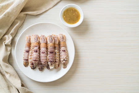 steamed crayfish or mantis shrimps or stomatopods with spicy seafood sauceの写真素材