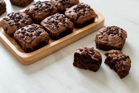dark chocolate brownies with chocolate chips on topの写真素材