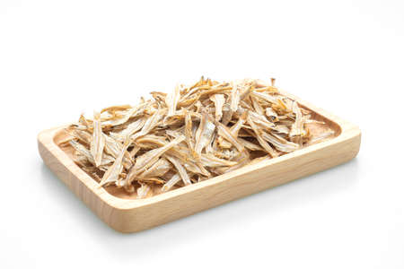 dried small crispy bake fish isolated on white backgroundの写真素材
