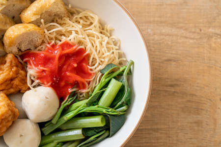 egg noodles with fish balls and shrimp balls in pink sauce, Yen Ta Four or Yen Ta Fo - Asian food...