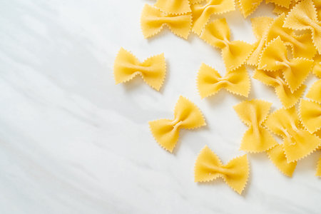 Dry uncooked farfalle pasta with copy spaceの写真素材