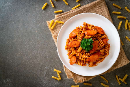 spiral or spirali pasta with tomato sauce and sausage - Italian food styleの写真素材