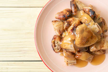 grilled bananas with coconut caramel sauce on plate