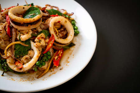 stir fried holy basil with octopus or squid and herb - Asian food style