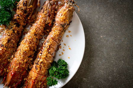 Stir Fried Mantis Shrimp with Garlic on white plate