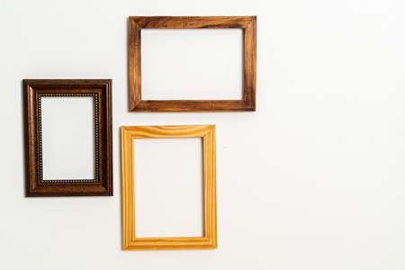empty picture frame on white wall background with copy spaceの写真素材