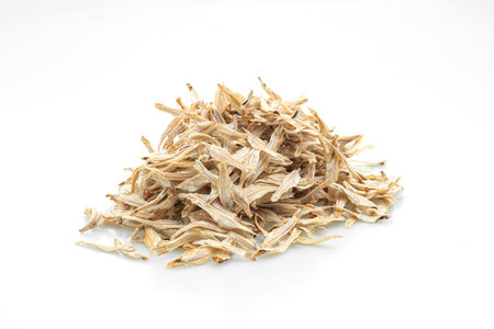 dried small crispy bake fish isolated on white backgroundの写真素材