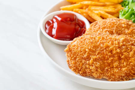 fried chicken breast fillet steak with French fries and ketchupの写真素材