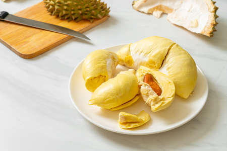 Durian riped and fresh ,durian peel on white plateの写真素材
