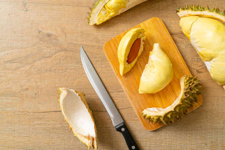 Durian riped and fresh ,durian peel on wooden boardの写真素材