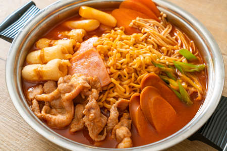 Budae Jjigae or Budaejjigae (Army stew or Army base stew). It is loaded with Kimchi, spam, sausages, ramen noodles and much more - popular Korean hot pot food styleの写真素材