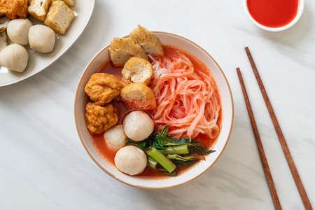 small flat rice noodles with fish balls and shrimp balls in pink soup, Yen Ta Four or Yen Ta Fo - Asian food styleの写真素材