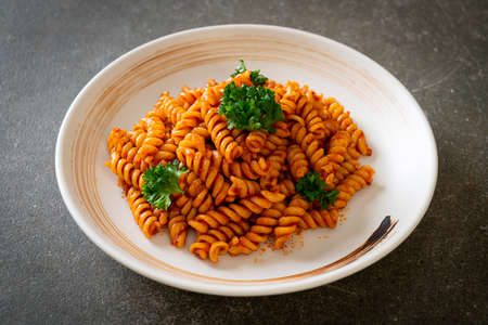 spiral or spirali pasta with tomato sauce and parsley - Italian food styleの写真素材