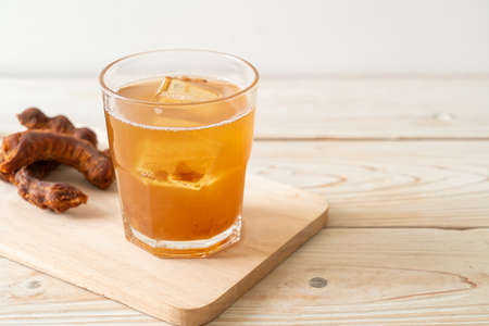 Delicious sweet drink tamarind juice and ice cube - healthy drink styleの写真素材