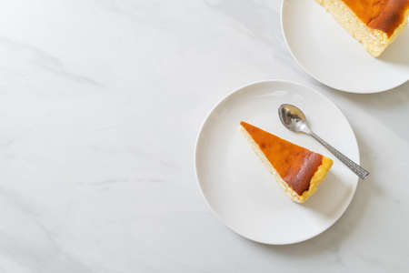 homemade burn cheesecake on white plate