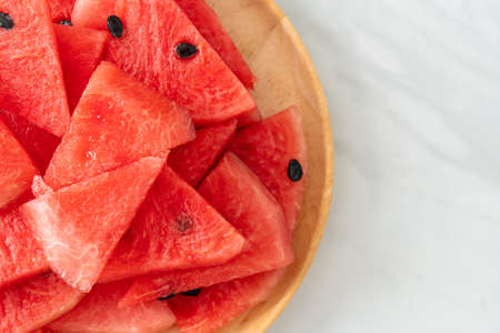 fresh watermelon sliced on wooden plateの写真素材