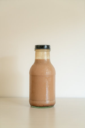 chocolate milk in glass bottle on tableの写真素材