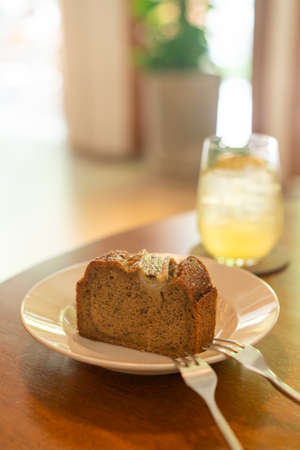 banana cake on plate in cafe restaurant - soft selective focus pointの写真素材
