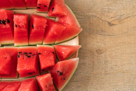 fresh watermelon sliced on wooden plateの写真素材