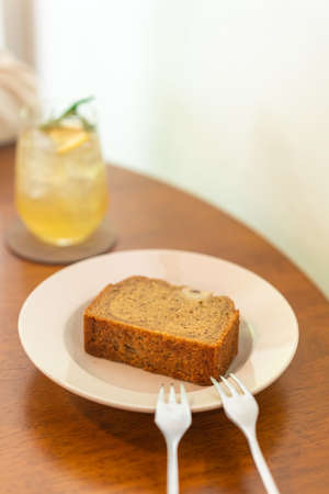 banana cake on plate in cafe restaurant - soft selective focus point