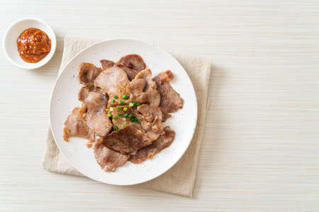 grilled pork neck sliced on plate in Asian styleの写真素材