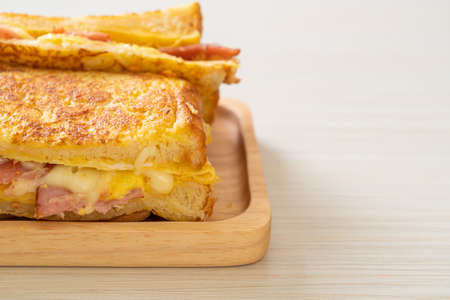Homemade French toast ham bacon cheese sandwich with eggの写真素材