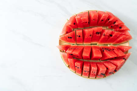 fresh watermelon sliced on wooden plateの写真素材
