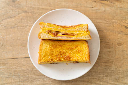 Homemade French toast ham bacon cheese sandwich with eggの写真素材