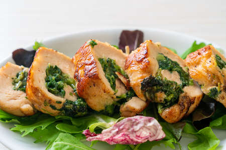 Baked chicken breast stuffed with cheese and spinachの写真素材