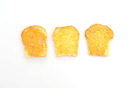 baked crispy bread with butter and sugar isolated on white backgroundの写真素材