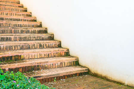 ourdoor brick stair step with white wall