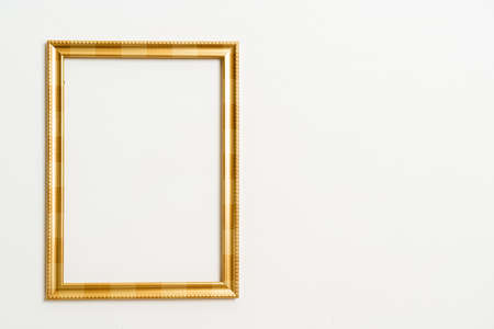 empty picture frame on white wall background with copy spaceの写真素材