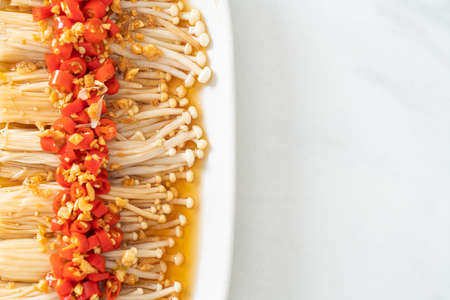 homemade steamed golden needle mushroom or enokitake with soy sauce, chilli and garlic