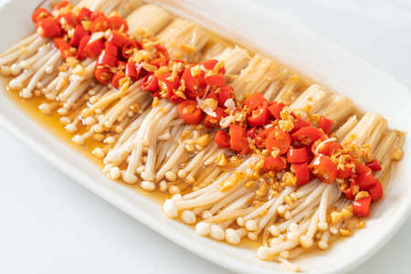 homemade steamed golden needle mushroom or enokitake with soy sauce, chilli and garlic