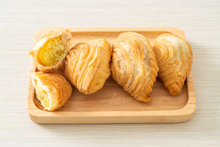 curry puff pastry stuffed beans on wooden plate
