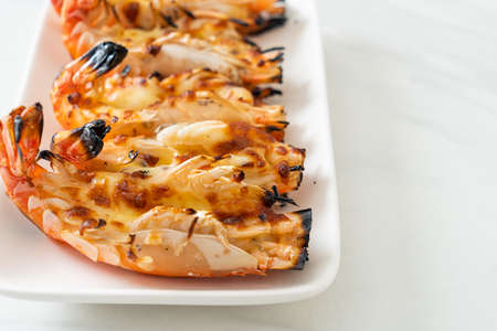 grilled river prawns or shrimps with cheese - seafood styleの写真素材