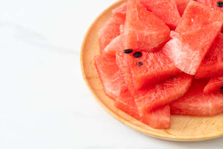 fresh watermelon sliced on wooden plateの写真素材