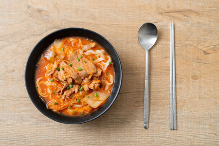 Korean udon ramen noodles with pork in kimchi soup - Asian food styleの写真素材