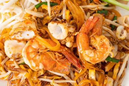 Pad Thai Seafood - Stir fried noodles with shrimps, squid or octopus and tofu in Thai styleの写真素材