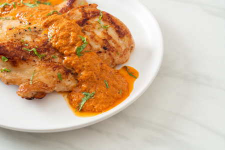 grilled chicken steak with red curry sauce - muslim food styleの写真素材