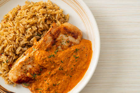 grilled chicken steak with red curry sauce and rice - muslim food styleの写真素材