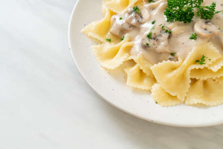 farfalle pasta with mushroom white cream sauce - Italian food styleの写真素材