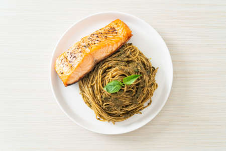 homemade pesto spaghetti pasta with grilled salmon - Italian food styleの写真素材