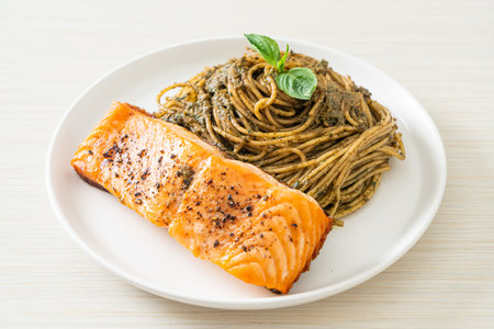 homemade pesto spaghetti pasta with grilled salmon - Italian food styleの写真素材
