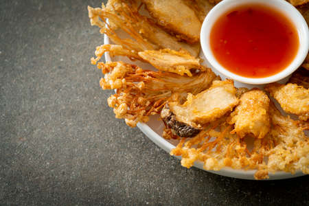deep fried Enoki mushroom and King Oyster mushroom with spicy dipping sauce - vegan food styleの写真素材