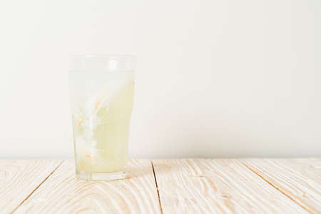 coconut water or coconut juice in glas with ice cubeの写真素材