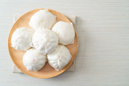 stuffed steamed bun on wood plate - Chinese food styleの写真素材