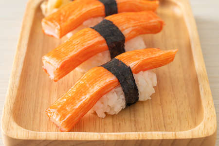 Crab Stick Sushi on wood plate - Japanese food styleの写真素材